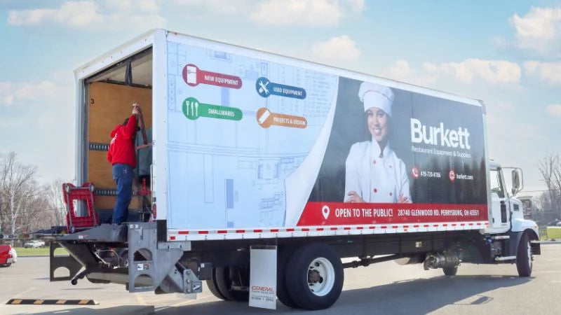 Burkett delivery truck unloading restaurant equipment for coffee shop installation project