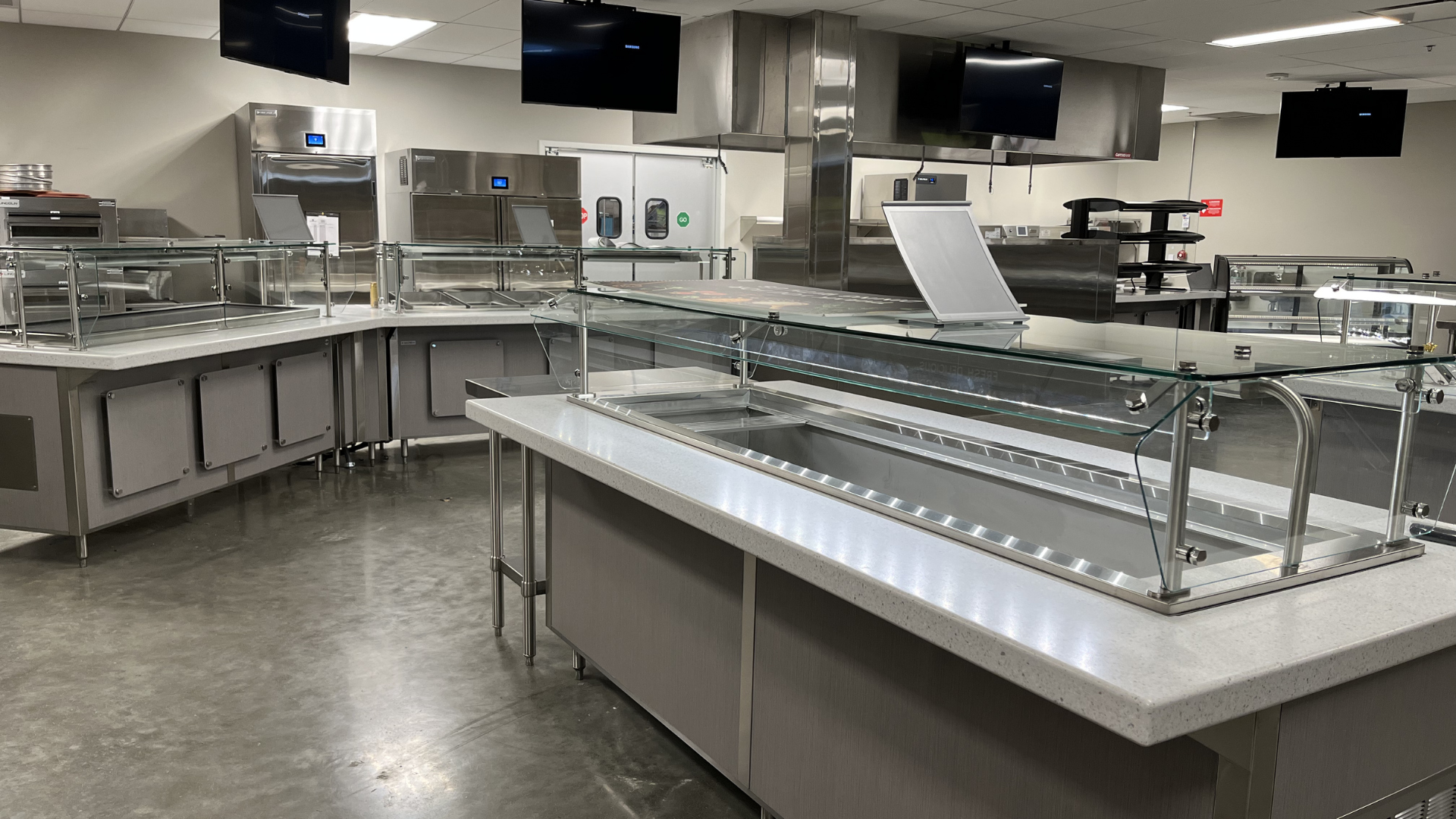 Modern kitchen with stainless steel counters and appliances