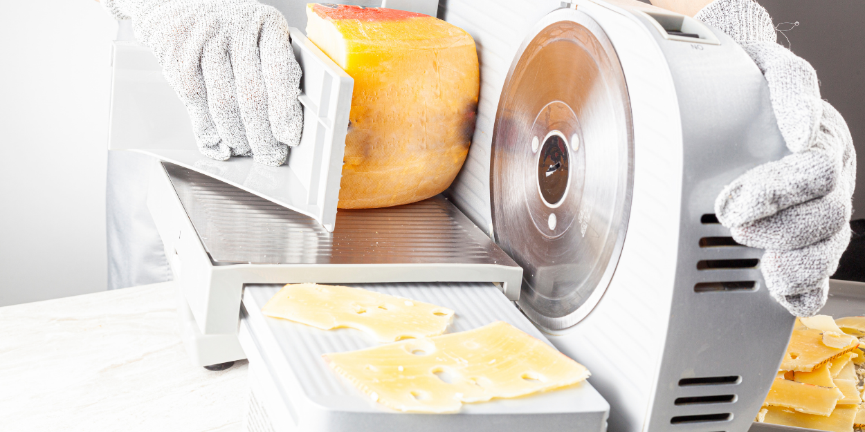 Commercial slicers cutting cheese with electric deli slicer machine