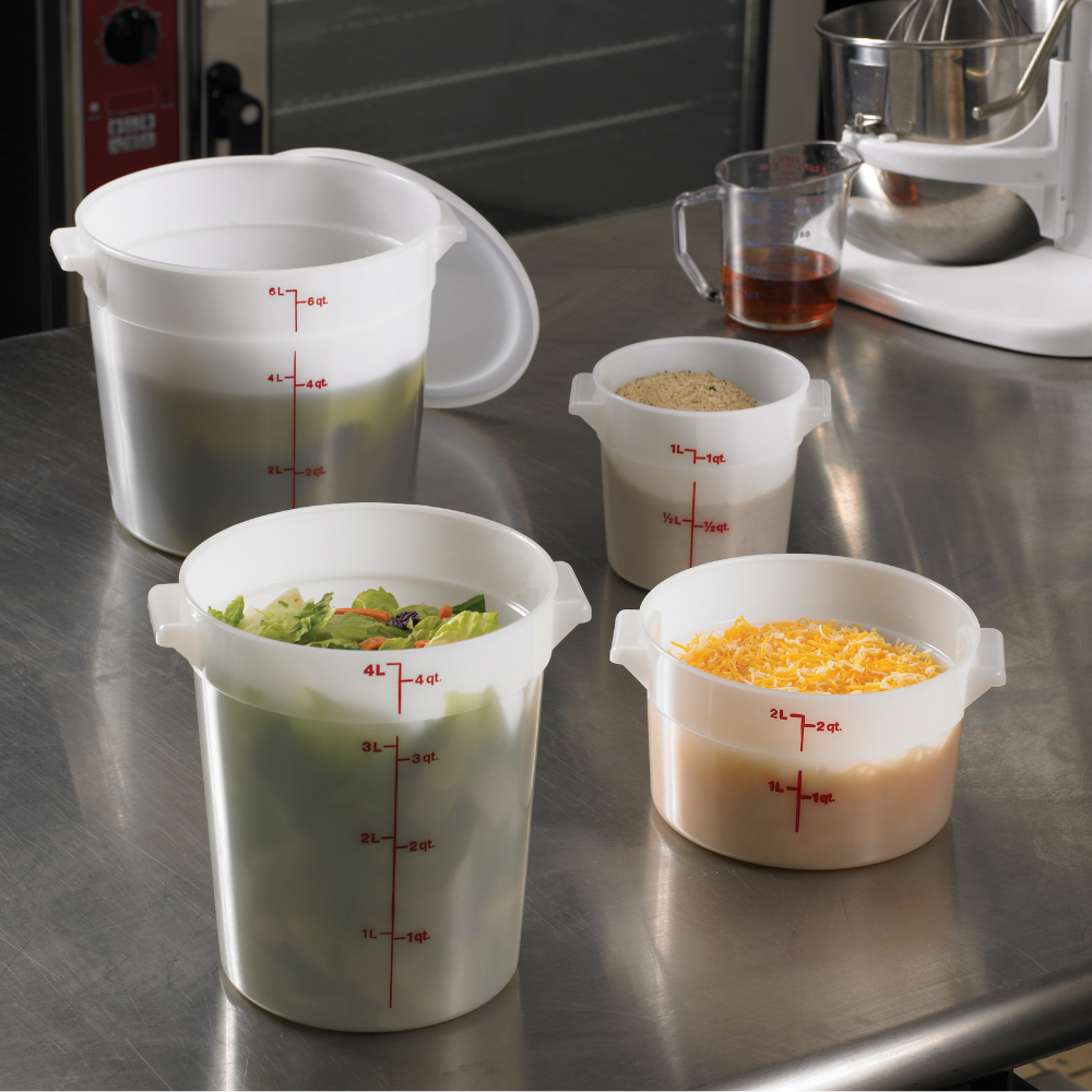 Round Cambro food storage containers on a stainless steel work table