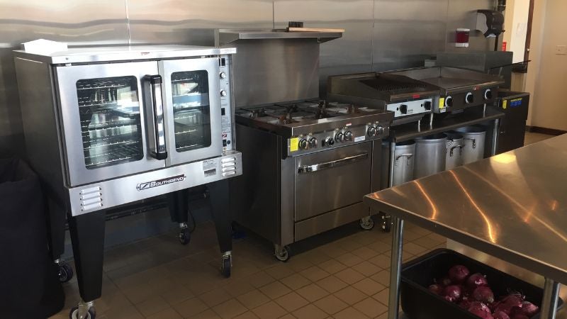 Cleveland Culinary Prep commercial kitchen with convection oven, range and prep table