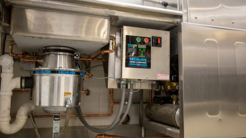 Commercial kitchen plumbing with food waste disposer and control system under prep sink
