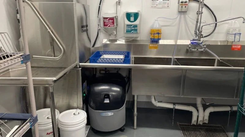 Three-compartment sink / prep sink area with adjacent stainless work table 