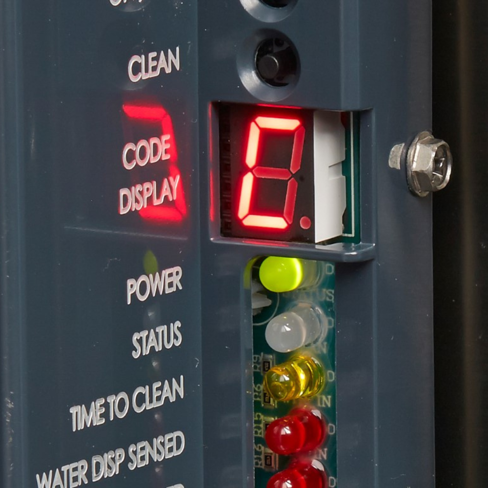 Control panel with digital display and indicator lights on a Scotsman ice & water dispenser.