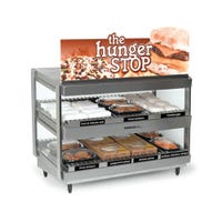 Stainless steel heated display case with food items and sign