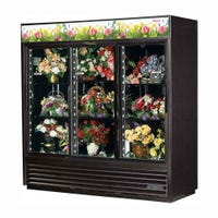 True GDM-69FC-HC-LD Black 3-Glass Sliding Door Floral Merchandiser in black filled with floral arrangements
